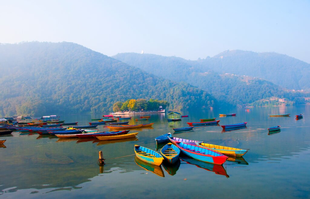 Colorful wooden boat at Fewa lake, Pokhara, Nepal.